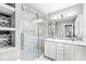 Bright bathroom features dual vanity, glass enclosed shower, and tile flooring at 4305 Central Ave, Indianapolis, IN 46205