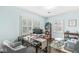 Bright bedroom with two windows, a glass top desk, and a cozy sitting area at 4305 Central Ave, Indianapolis, IN 46205