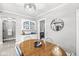 Cozy dining room with a vintage hutch, modern chandelier, and neutral colors at 4305 Central Ave, Indianapolis, IN 46205