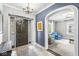 Elegant foyer featuring decorative tile flooring, an archway, and glimpses into the living space beyond at 4305 Central Ave, Indianapolis, IN 46205