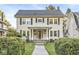 Charming two-story home featuring a covered porch, traditional windows, and a well-maintained front yard at 4305 Central Ave, Indianapolis, IN 46205
