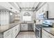 Charming kitchen with stainless appliances, granite countertops, and ample storage at 4305 Central Ave, Indianapolis, IN 46205
