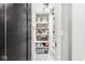 Organized walk-in pantry with shelving for ample food and storage at 4305 Central Ave, Indianapolis, IN 46205