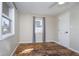 This bedroom boasts a ceiling fan, neutral walls, hardwood floors, and two windows at 4623 Clark St, Anderson, IN 46013