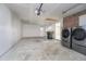 A bright garage with laundry, painted walls, and an automatic door opener at 4623 Clark St, Anderson, IN 46013
