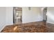 Open-concept space with hardwood flooring seamlessly connecting the living area to the kitchen at 4623 Clark St, Anderson, IN 46013