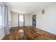 Bright living room featuring hardwood floors, a large window, and neutral walls at 4623 Clark St, Anderson, IN 46013