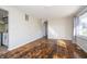 Bright living room featuring wood floors and neutral walls, enhanced by ample windows and natural light at 4623 Clark St, Anderson, IN 46013