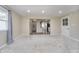 This carpeted living room features neutral walls and access to the kitchen at 4623 Clark St, Anderson, IN 46013