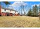 Expansive backyard featuring a spacious lawn, mature trees, and a charming pergola at 4783 Briarwood Trce, Carmel, IN 46033