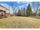 Spacious backyard with a patio, wooden pergola, and mature trees, offering a serene outdoor space at 4783 Briarwood Trce, Carmel, IN 46033