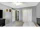 Cozy bedroom features neutral paint, ceiling fan, and closet for ample storage space at 4783 Briarwood Trce, Carmel, IN 46033