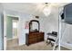 Charming bedroom with chandelier lighting, loft bed, and vanity space for a personalized touch at 4783 Briarwood Trce, Carmel, IN 46033