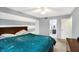 Well-lit bedroom leading to the ensuite bathroom at 4783 Briarwood Trce, Carmel, IN 46033