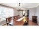 Elegant dining room with hardwood floors, chandelier lighting, and space for a large dining table at 4783 Briarwood Trce, Carmel, IN 46033