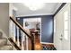 Inviting foyer with hardwood floors, white trim, and a staircase, creating a welcoming entrance at 4783 Briarwood Trce, Carmel, IN 46033