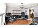 A home office with built-in desks, hardwood floors, and neutral paint at 4783 Briarwood Trce, Carmel, IN 46033