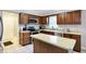Spacious kitchen features stainless steel appliances, a center island, and ample cabinet space for storage at 4783 Briarwood Trce, Carmel, IN 46033
