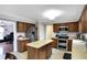 Spacious kitchen features stainless steel appliances, a center island, and ample cabinet space for storage at 4783 Briarwood Trce, Carmel, IN 46033