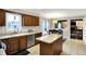 Spacious kitchen with stainless steel appliances, an island and an eat-in dining area at 4783 Briarwood Trce, Carmel, IN 46033