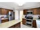 Spacious kitchen features stainless steel appliances, a center island, and ample cabinet space for storage at 4783 Briarwood Trce, Carmel, IN 46033