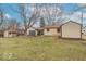 The backyard offers a large yard, shed, and a detached two car garage at 4836 W 71St St, Indianapolis, IN 46268