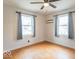 Bedroom featuring hardwood floors, neutral paint, a ceiling fan and two windows for light at 4836 W 71St St, Indianapolis, IN 46268