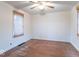 Bedroom featuring hardwood floors, neutral walls, and great natural light at 4836 W 71St St, Indianapolis, IN 46268