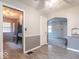 Open dining area leading to a modern kitchen with stainless steel appliances at 4836 W 71St St, Indianapolis, IN 46268