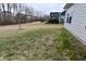 Expansive backyard featuring a manicured lawn and mature trees for added privacy, plus a well-maintained fence at 5176 Green Valley Ln, Noblesville, IN 46062
