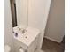 This bathroom has a modern sink and vanity, with an open door revealing wood floors at 5176 Green Valley Ln, Noblesville, IN 46062