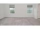 Bedroom with two windows allowing natural light and neutral carpet at 5176 Green Valley Ln, Noblesville, IN 46062