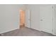 A bedroom featuring a view into a bathroom, a closet, and neutral carpeting at 5176 Green Valley Ln, Noblesville, IN 46062