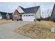 A well-maintained home boasting brick accents, siding, and a neatly paved driveway at 5176 Green Valley Ln, Noblesville, IN 46062