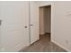 An open doorway features wood floors that contrast against the white trim and doors at 5176 Green Valley Ln, Noblesville, IN 46062