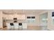 Modern kitchen featuring a spacious island, sleek white cabinetry, and stylish pendant lighting at 5176 Green Valley Ln, Noblesville, IN 46062