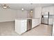 Island view in kitchen with stainless dishwasher, granite countertops, sink, and white cabinets in an open floor plan at 5176 Green Valley Ln, Noblesville, IN 46062