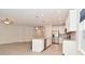Bright kitchen features white cabinets, granite countertops, stainless appliances, and an island with pendant lighting at 5176 Green Valley Ln, Noblesville, IN 46062