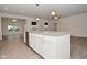 View of kitchen island featuring granite countertops, a stainless sink, white cabinets, and pendant lighting at 5176 Green Valley Ln, Noblesville, IN 46062