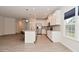 Modern kitchen with stainless steel appliances, granite countertops, and a center island with bar stools at 5176 Green Valley Ln, Noblesville, IN 46062
