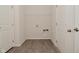 A laundry room features wood floors and access to washer and dryer hookups at 5176 Green Valley Ln, Noblesville, IN 46062