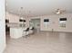 Open-concept living space with island kitchen, modern flooring, and plenty of natural light at 5176 Green Valley Ln, Noblesville, IN 46062