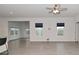 Bright and airy living room with modern flooring, ceiling fan, and views of the outdoors at 5176 Green Valley Ln, Noblesville, IN 46062