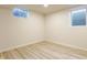 Basement bedroom with luxury vinyl plank flooring and natural lighting at 5210 Ashbourne Ln, Indianapolis, IN 46226
