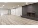 Spacious basement with vinyl plank flooring and brick fireplace at 5210 Ashbourne Ln, Indianapolis, IN 46226