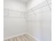 A closet with wire shelving, white walls, and gray floors at 5210 Ashbourne Ln, Indianapolis, IN 46226