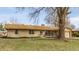 Beautiful one-story brick home featuring a well-maintained front yard and classic architectural design at 5210 Ashbourne Ln, Indianapolis, IN 46226
