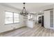 Open-concept kitchen with white cabinetry, stainless steel appliances, and a breakfast bar at 5210 Ashbourne Ln, Indianapolis, IN 46226