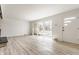 This large living area is filled with natural light and gorgeous floors at 5210 Ashbourne Ln, Indianapolis, IN 46226