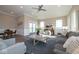 Relaxing living area featuring comfortable seating, plenty of natural light, and a seamless flow to the dining and kitchen spaces at 5546 Tart Blvd, Indianapolis, IN 46239
